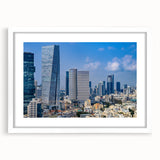 Abstract art print of Tel Aviv skyline in muted gray and blue tones on a framed white mat, suitable for dining room decor.