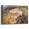 Black and white framed canvas featuring a vintage-style landscape painting of a Middle Eastern scenery.