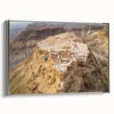 Framed canvas of a Middle Eastern landscape in muted earth tones, ideal for adding a vintage touch to any room.