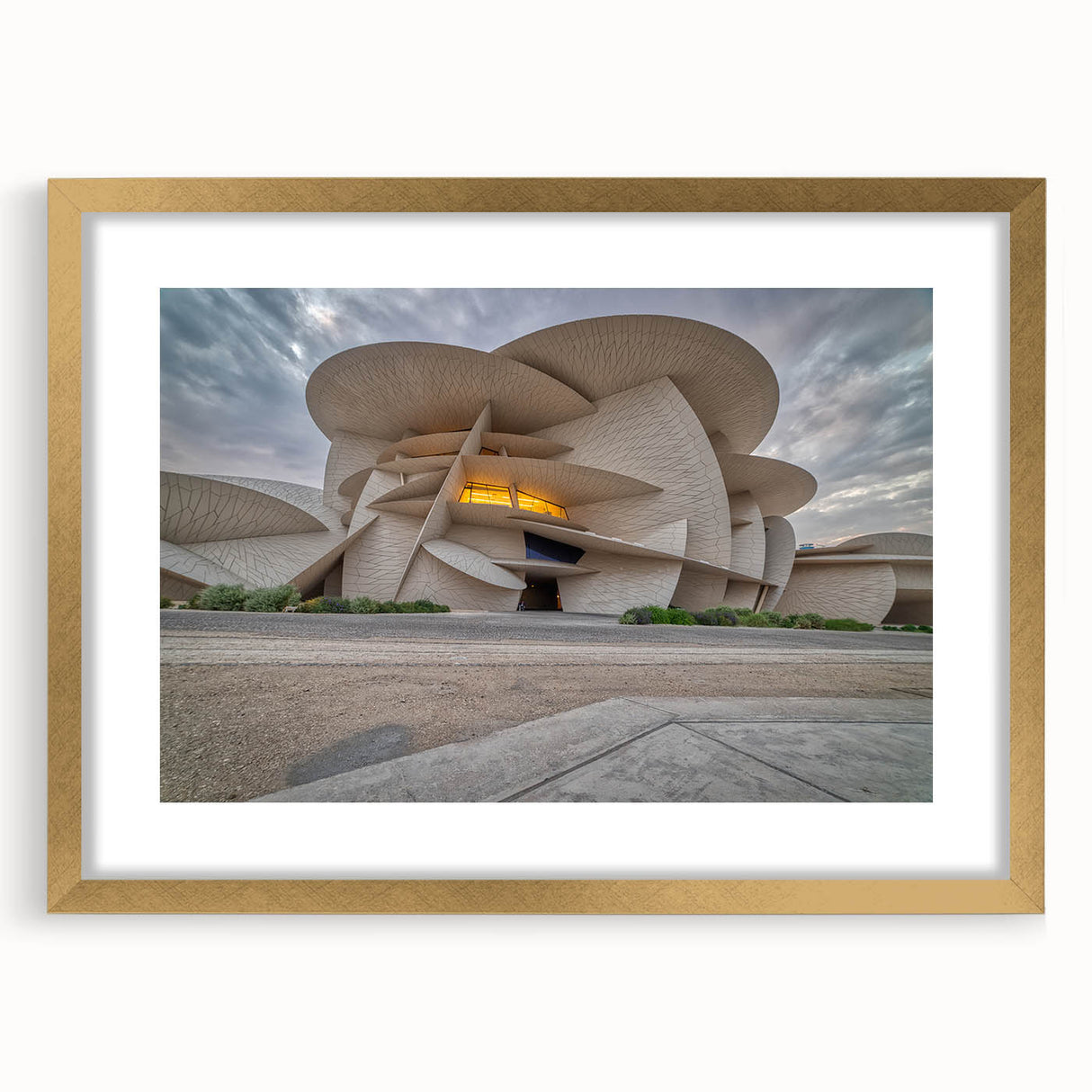 Extra large abstract art print depicting Middle Eastern scenery in textured gold and earth tones, framed with mat.