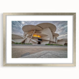 Textured abstract art print of Middle Eastern scenery in muted earth tones, framed in silver, suitable for bedroom decor.