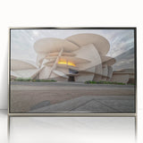 Mid-century modernist art depicting a Qatar scenery in muted earth tones on a silver-framed acrylic print.