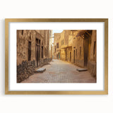 Extra large abstract art print of a textured Middle Eastern landscape in muted gold and brown tones, framed with a mat.