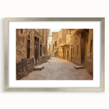 Textured abstract art print depicting a Middle Eastern scenery in muted earth tones, framed in silver, ideal for bedroom art.