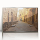 Mid-century modernist art depicting a Saudi Arabian landscape in muted earth tones on a silver-framed acrylic print.