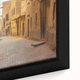 Black wall art featuring a textured, colorful Middle Eastern scenery on an extra large framed canvas.