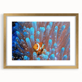 Extra large abstract art print depicting a textured ocean scene in blue and green hues, framed in gold.