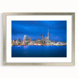 Textured abstract art print of Auckland skyline in muted blue and gray tones on a framed canvas, suitable for bedroom decor.