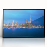 Large abstract wall art depicting Auckland's skyline in muted gray and blue tones on a framed acrylic panel.
