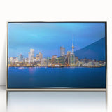 Mid-century modernist art depicting Auckland skyline in muted blue tones on framed acrylic.