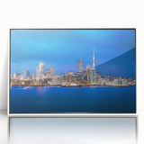 Framed acrylic print of Auckland skyline in muted gray and blue tones, ideal for modern art wall decor.