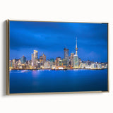 Framed canvas wall art featuring a vintage poster-style landscape of Auckland with dominant black tones.