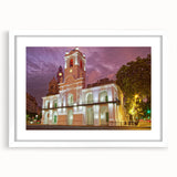 Abstract art print of Buenos Aires skyline in muted gray and blue tones on a framed white mat, ideal for dining room decor.