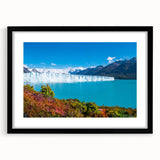 Abstract art print depicting vibrant, colorful scenery of South America on a large textured canvas, framed in black.