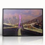 Large abstract wall art featuring a stylized Brazilian landscape in vibrant colors, framed in black acrylic.