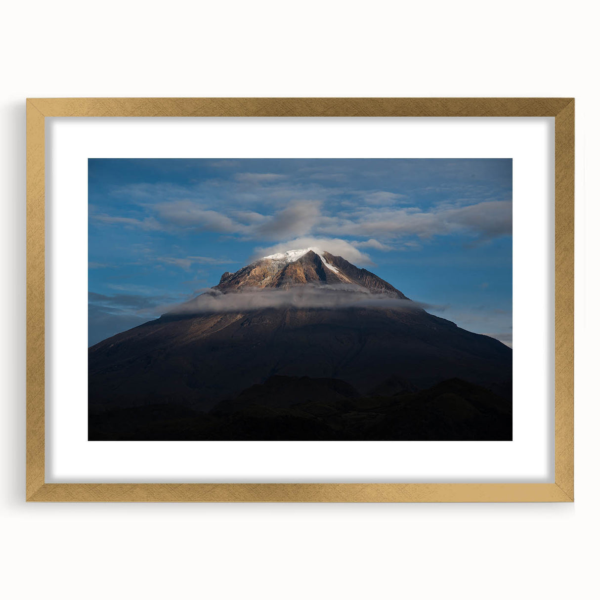 Extra large abstract art print of a textured Colombian landscape in muted earth tones, framed in gold.