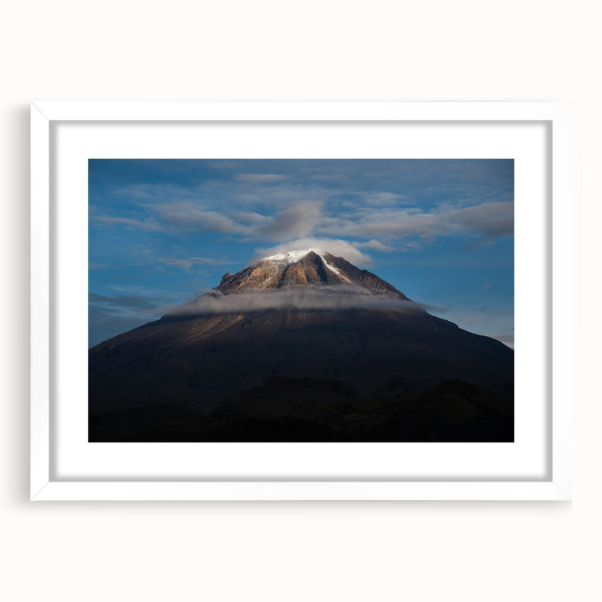 Abstract art print depicting a vibrant, colorful Colombian landscape on a framed white mat, ideal for dining room decor.