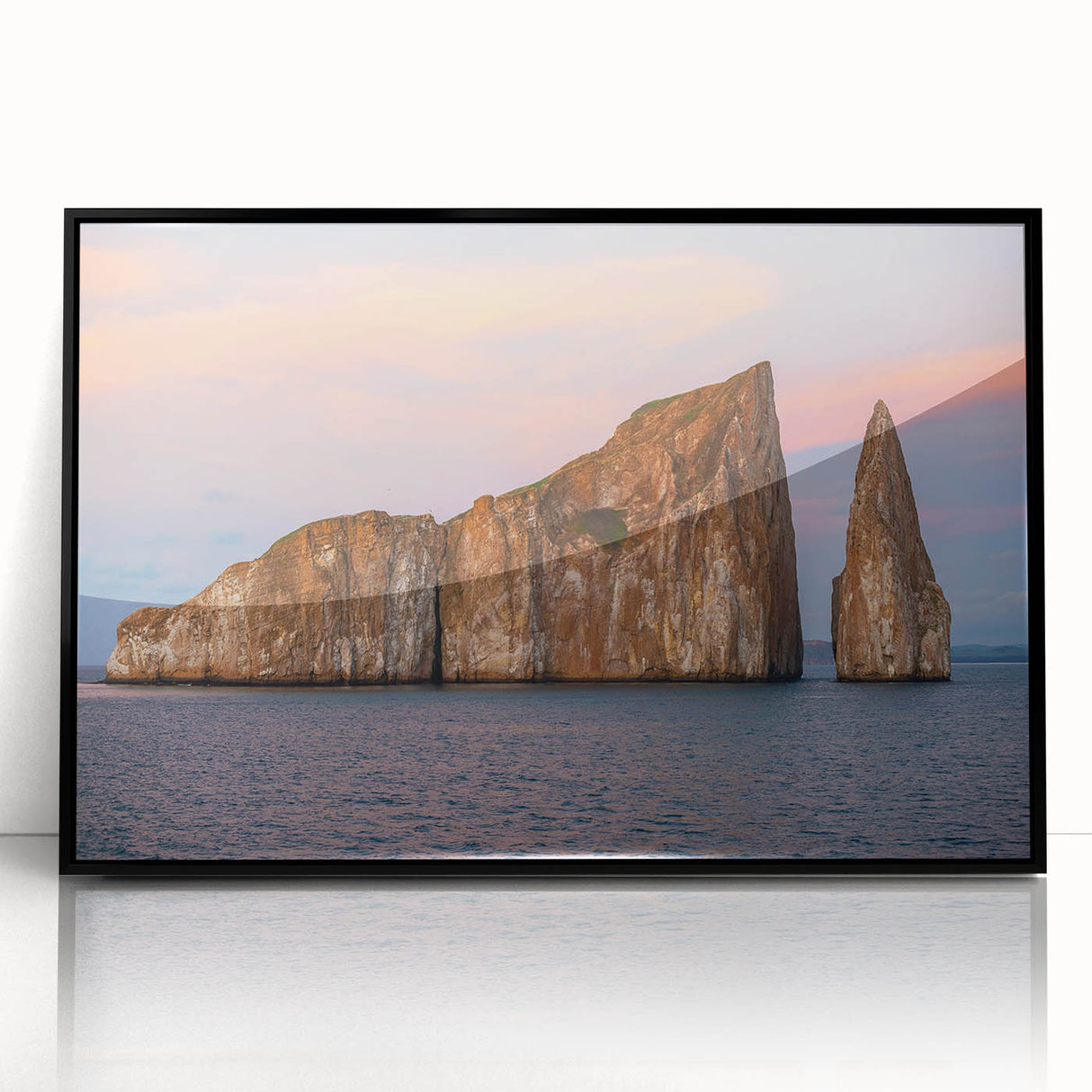 Large abstract wall art of a Galapagos scenery in muted earth tones, framed in black acrylic.