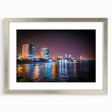 Textured art depicting an abstract South American landscape in earthy tones, framed with a silver mat.