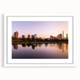 Abstract art print depicting vibrant, multicolored Alabama scenery on a white-framed canvas.