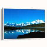 Vintage poster art of Denali, Alaska in vibrant colors on a large framed canvas, ideal for living room decor.