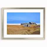 Textured abstract art print of an Alaskan landscape in muted earth tones on a framed silver mat, suitable for bedroom decor.