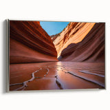 Framed canvas of Coyote Buttes landscape in Arizona with silver frame, featuring earth tones and blue sky.