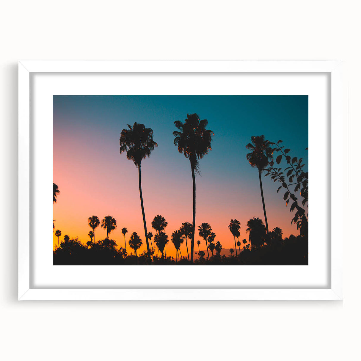 Abstract art print of Los Angeles skyline in muted gray and blue tones, framed with a white mat.