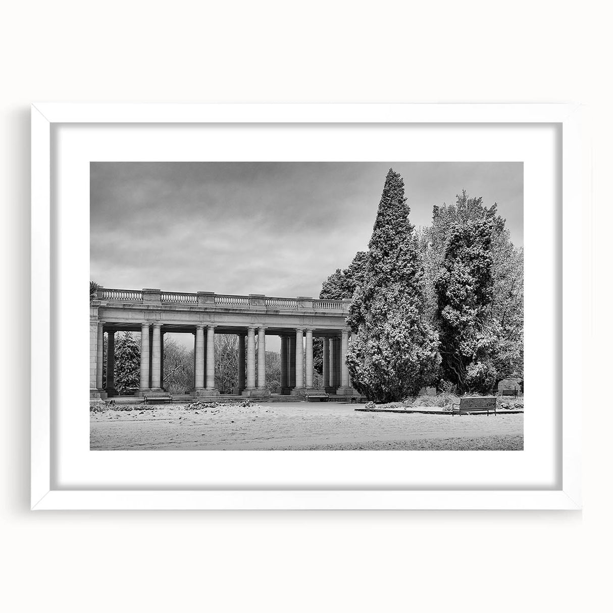 Abstract art print depicting Denver skyline in muted blue tones on a framed white mat, suitable for dining room decor.
