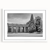 Abstract art print depicting Denver skyline in muted blue tones on a framed white mat, suitable for dining room decor.