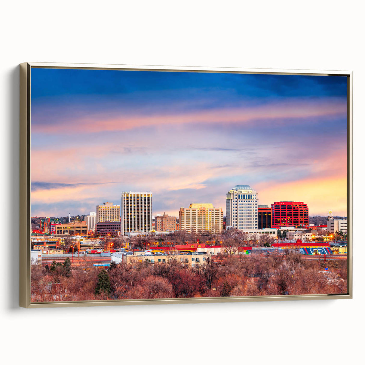 Framed canvas depicting a vintage-style landscape of Colorado Springs in muted gold and black tones.