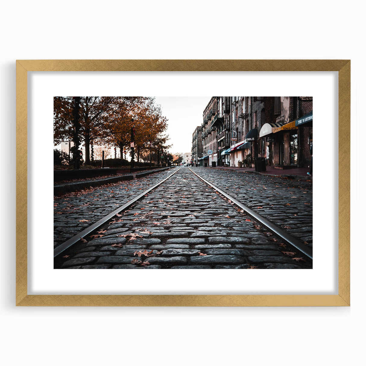 Extra large abstract art print of Savannah landscape in muted earth tones on a textured canvas, framed in gold.