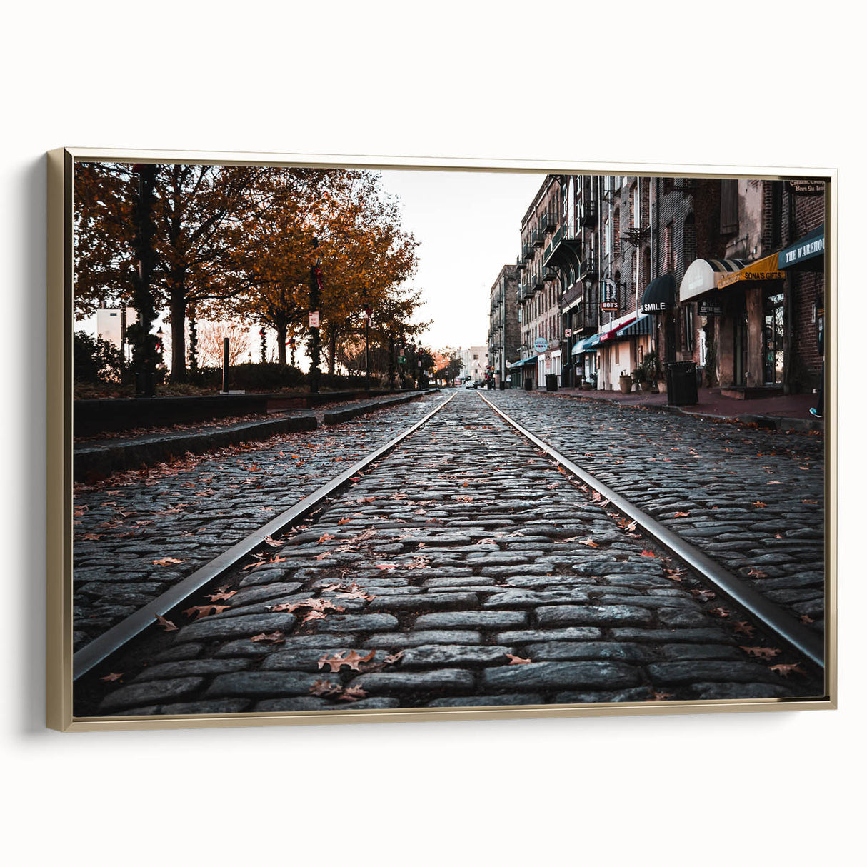 Framed canvas depicting a vintage-style Savannah landscape in gold and black tones, suitable for bedroom wall art.