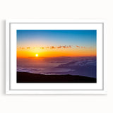 Abstract art print of a Maui landscape in muted green and blue tones on a framed white mat.