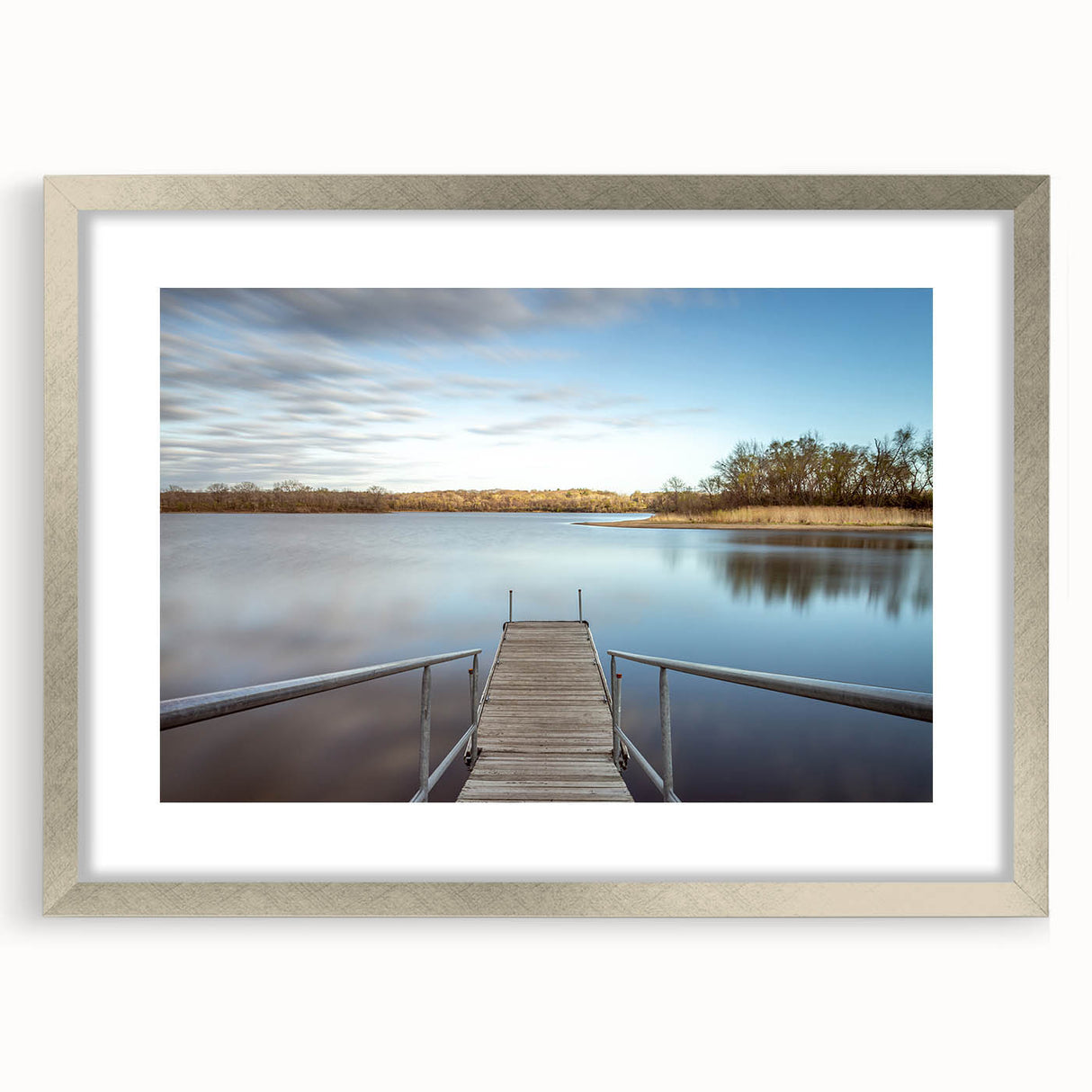 Textured abstract art print of Iowa scenery in muted earth tones, framed in silver, suitable for bedroom decor.