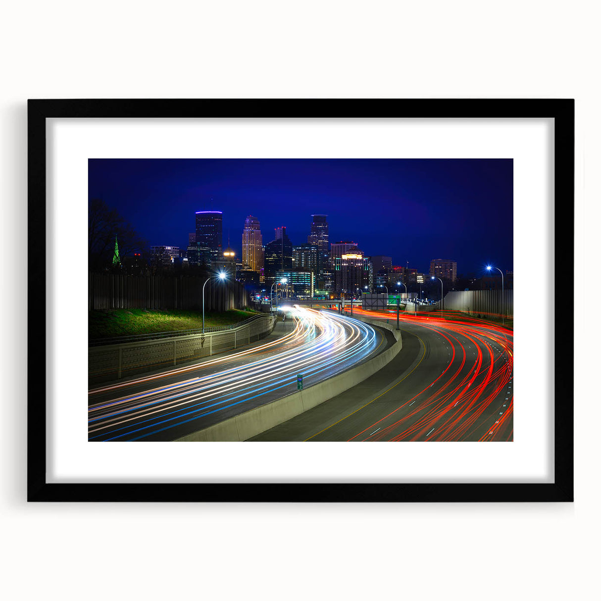 Extra large colorful abstract art print of Minneapolis skyline, in a black frame with mat, ideal for living room decor.