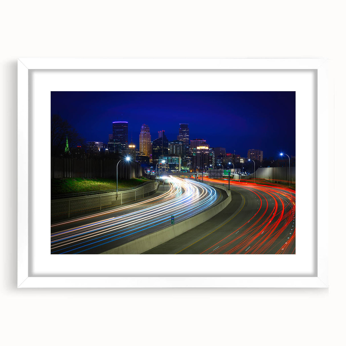 Abstract art print of Minneapolis skyline in muted blue and gray tones on a framed white mat, suitable for dining room decor.