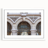 Abstract art print of St. Louis skyline in muted gray and blue tones on a framed white mat, ideal for dining room decor.