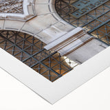 Art deco poster of St. Louis skyline in muted gold and blue tones on rolled canvas, suitable for dining room wall art.