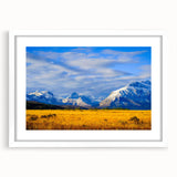Abstract art print depicting a Montana landscape in muted earth tones on a framed white mat.