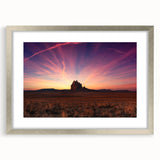 Textured abstract art print of a New Mexico landscape in muted earth tones on a framed canvas, suitable for bedroom decor.