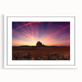 Abstract art print of New Mexico scenery in muted earth tones on a framed white mat, suitable for dining room decor.