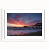 Abstract art print of the Outer Banks in muted blue and gray tones on a framed white mat.