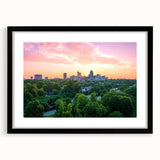 Colorful abstract art print of Raleigh skyline in vibrant hues on a large framed canvas, suitable for living room decor.