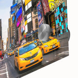 Large abstract wall art depicting the Manhattan skyline in muted gray and blue tones on acrylic glass.
