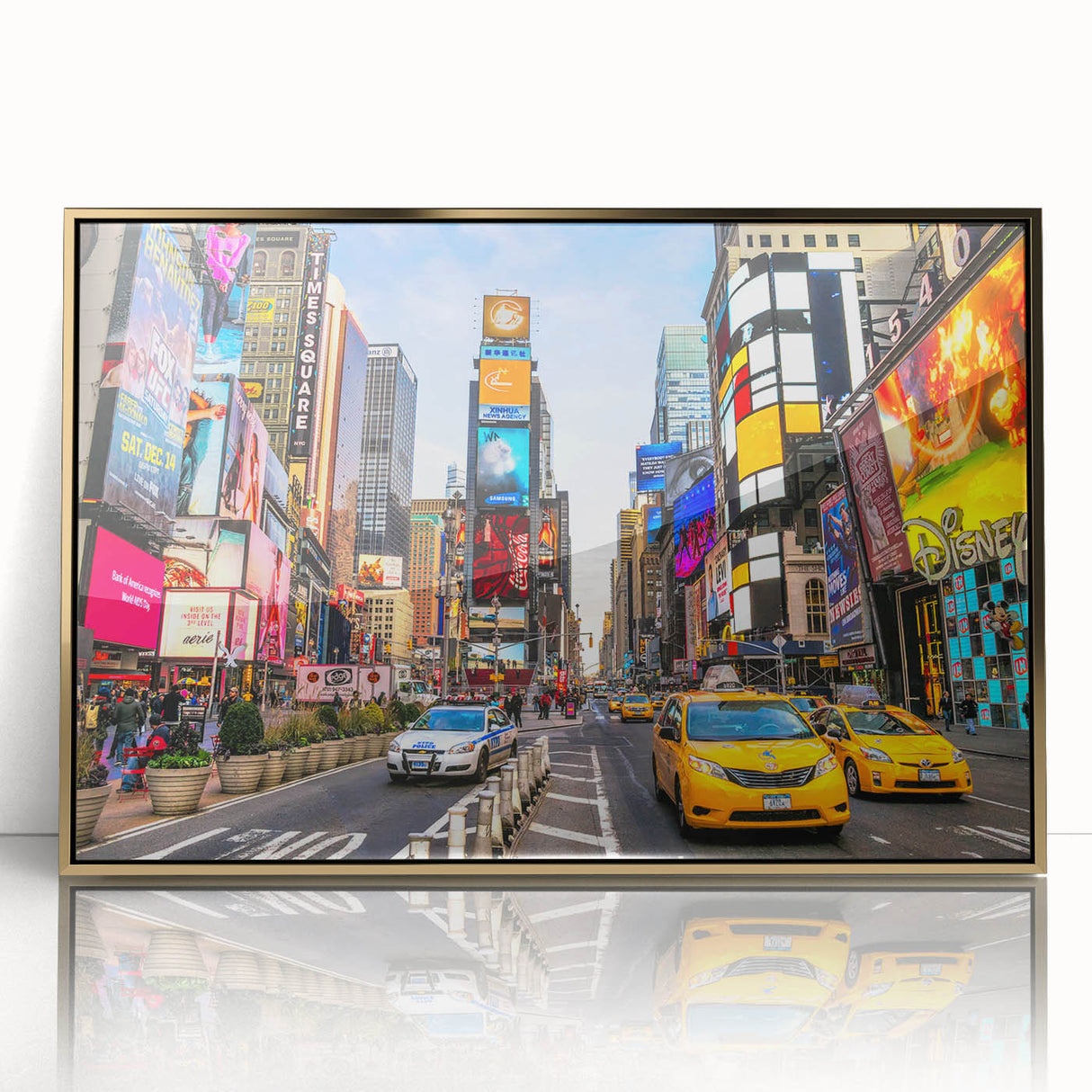 Acrylic print of Manhattan skyline in gold and black tones, framed, reflecting mid-century modernist style.