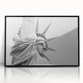 Large abstract wall art of the NYC skyline and Statue of Liberty in muted black and gray tones on framed acrylic.