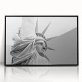 Large abstract wall art of the NYC skyline and Statue of Liberty in muted black and gray tones on framed acrylic.