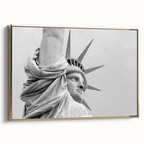 Framed canvas featuring a vintage-style landscape of the Statue of Liberty in black and gold tones.