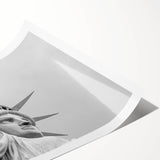 Extra large rolled canvas print of the Statue of Liberty in muted green and blue tones.